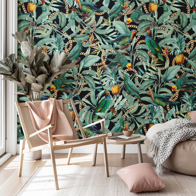 Living room with a tropical leaf and parrot wallpaper, wooden chair, and beige sofa.