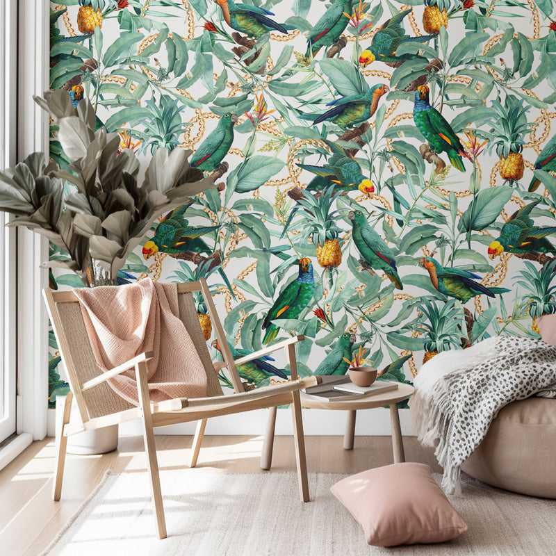 Living room with a tropical parrot wallpaper and wooden chair, and beige sofa.