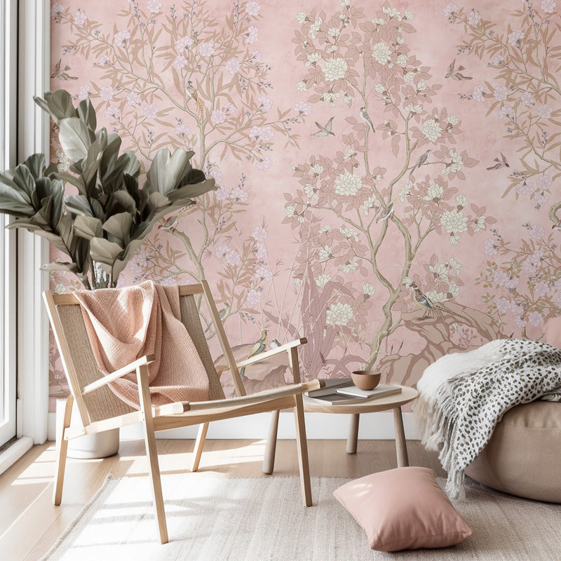Living room with chinoiserie wallpaper, wooden chair, and decorative pillows.