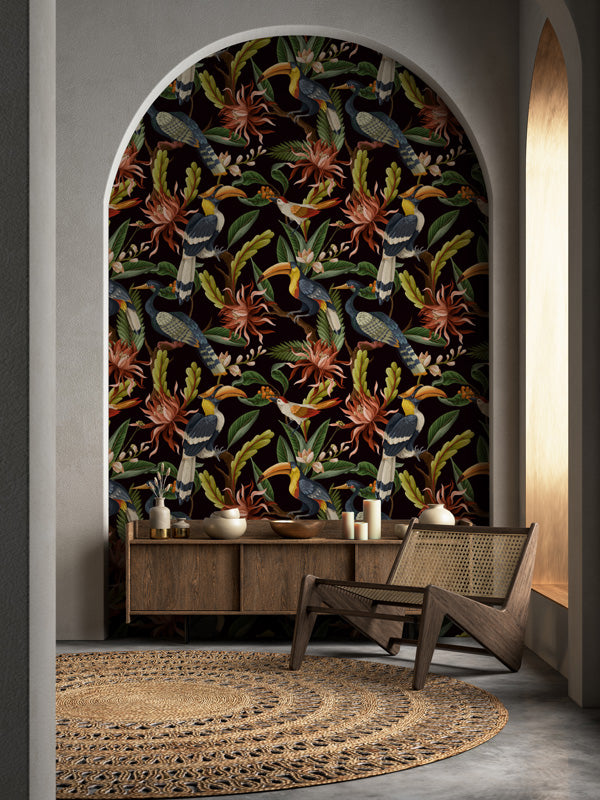 Decorative wall with botanical wallpaper, wooden furniture, and rug in a room.