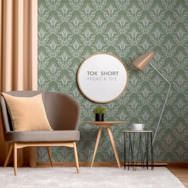 Living room with green wallpaper, brown chair, and round mirror.