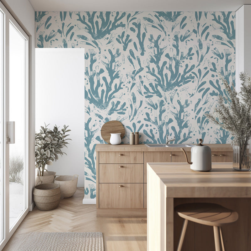 Modern interior with a dining table and chairs against a wall with blue wallpaper.