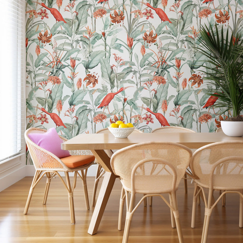 Dining room with floral wallpaper, wooden table, and wicker chairs.