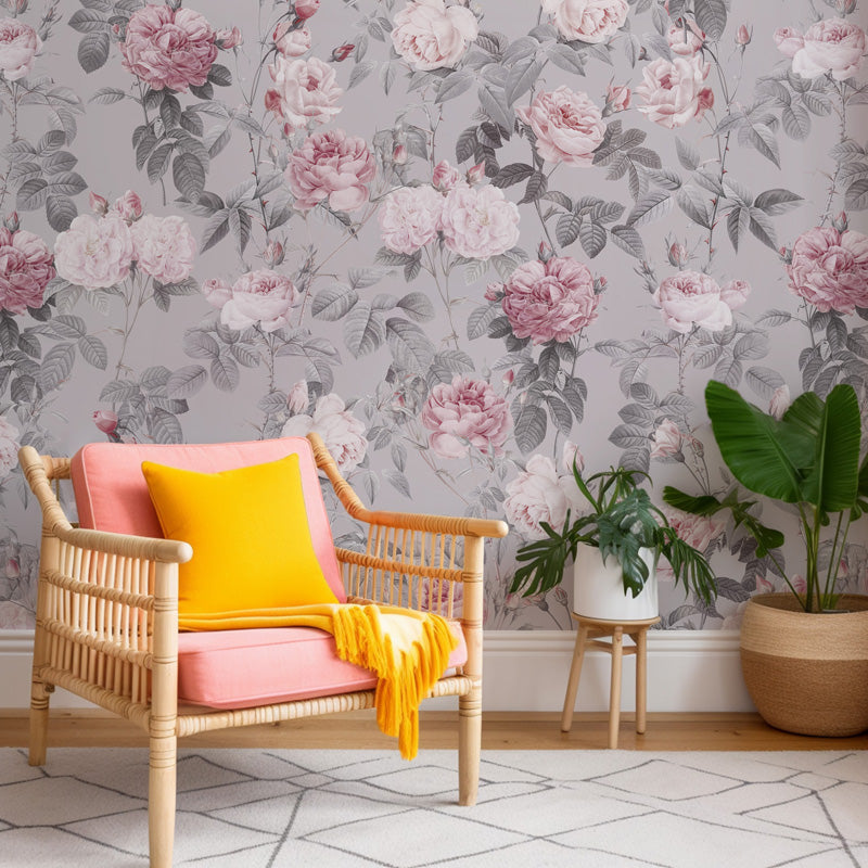 Chair with pink cushion and yellow blanket against gray floral wallpaper