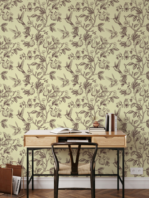 Floral wallpaper in a room with a desk and chair.