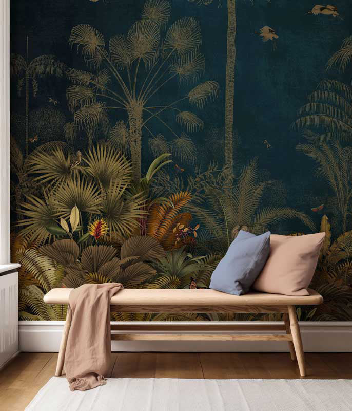 Wooden bench with pillows against a tropical wall mural