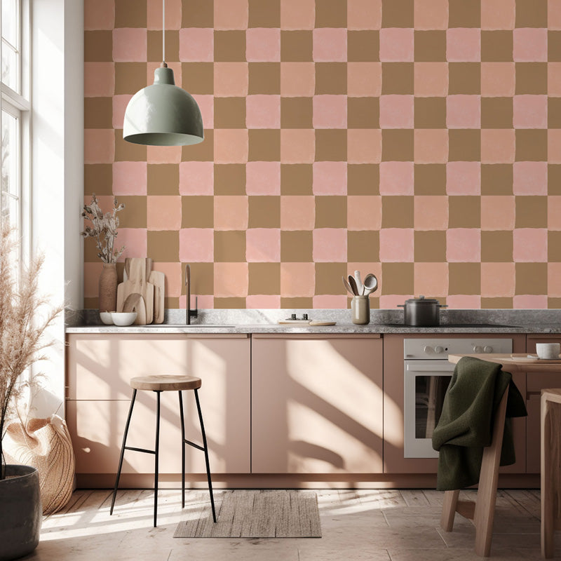 Modern kitchen with checkered wallpaper, wooden cabinets, and a bar stool.