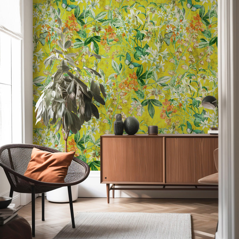 Modern living room with floral wallpaper, wooden cabinet, and decorative items.