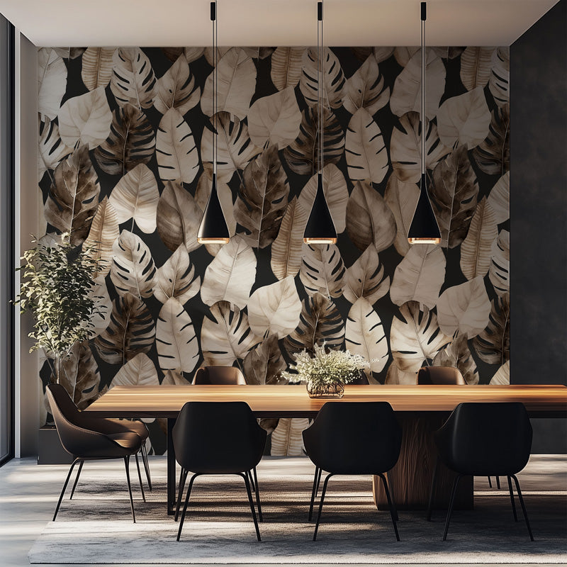Dining area with a large leaves wallpaper, wooden table, and black chairs.