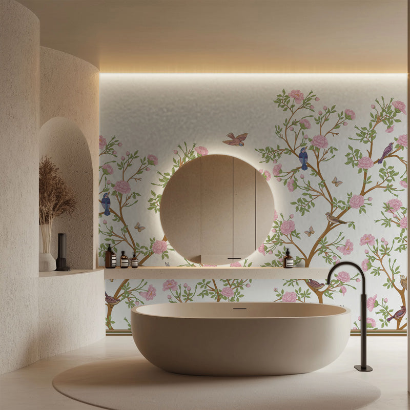Modern bathroom with a freestanding bathtub, chinoiserie wallpaper, and decorative elements.