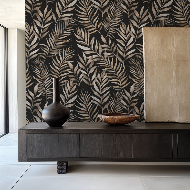 Modern interior with a dark wooden console table against a leaf wallpaper.