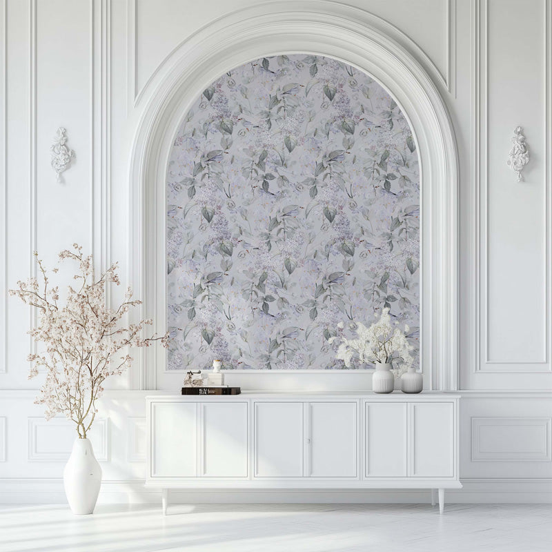 Decorative wall with floral wallpaper behind a white console table.