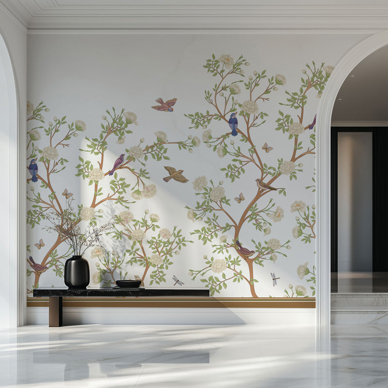 Decorative wallpaper mural with floral branches and birds in a modern interior setting.