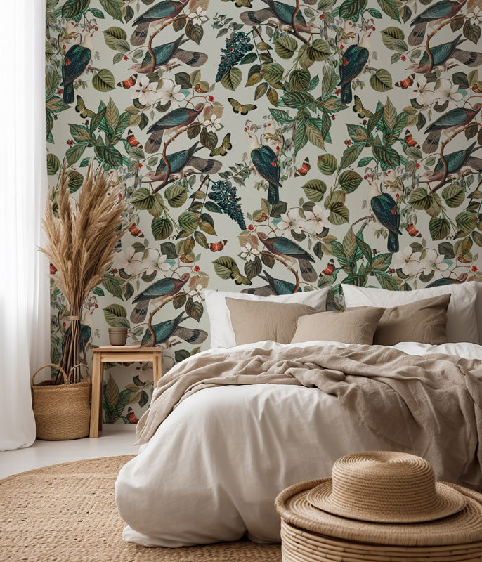 Bedroom with nature wallpaper featuring birds and foliage, beige bedding, and natural decor elements.
