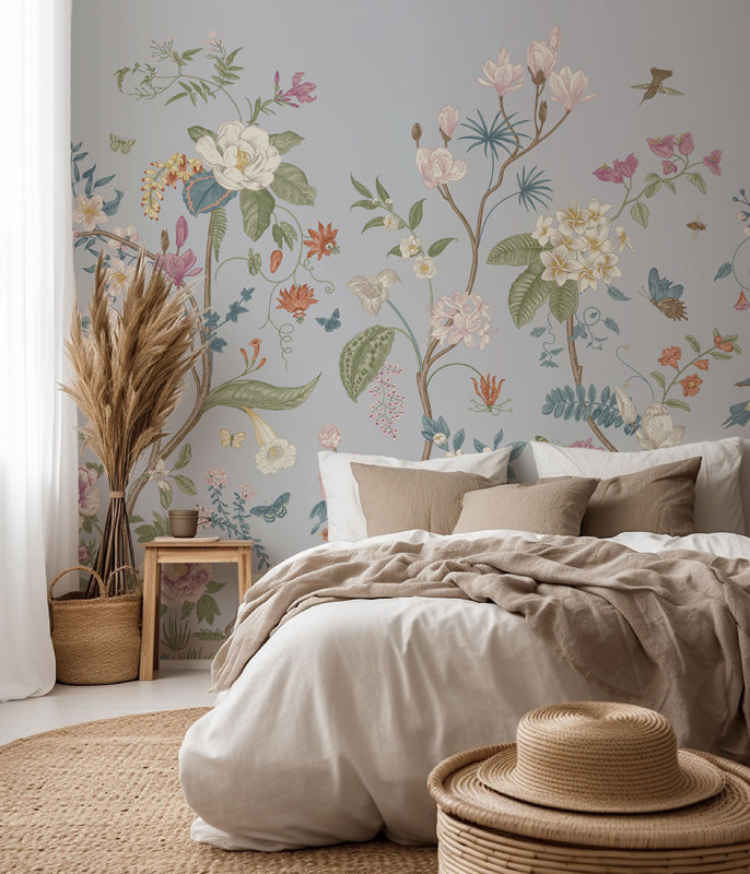 Bedroom with floral wallpaper, bed with beige bedding, and decorative elements.