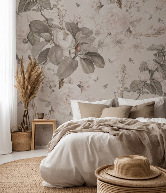 Bedroom with floral wallpaper, bed with beige bedding, and decorative elements.