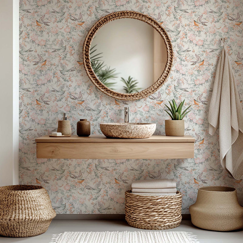 Bathroom with wooden vanity, round mirror, and decorative elements against a floral wallpaper.