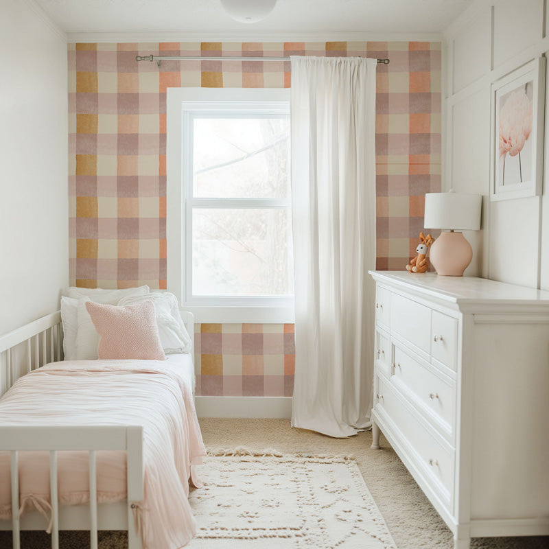 Children's bedroom with pastel wallpaper, white bed, and dresser.