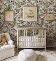 Nursery room with floral wallpaper, crib, and decorative elements.